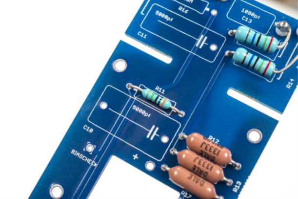 R11 and R16 (30 M&Omega;) being installed on the D-12 PCB — critical high-impedance node.